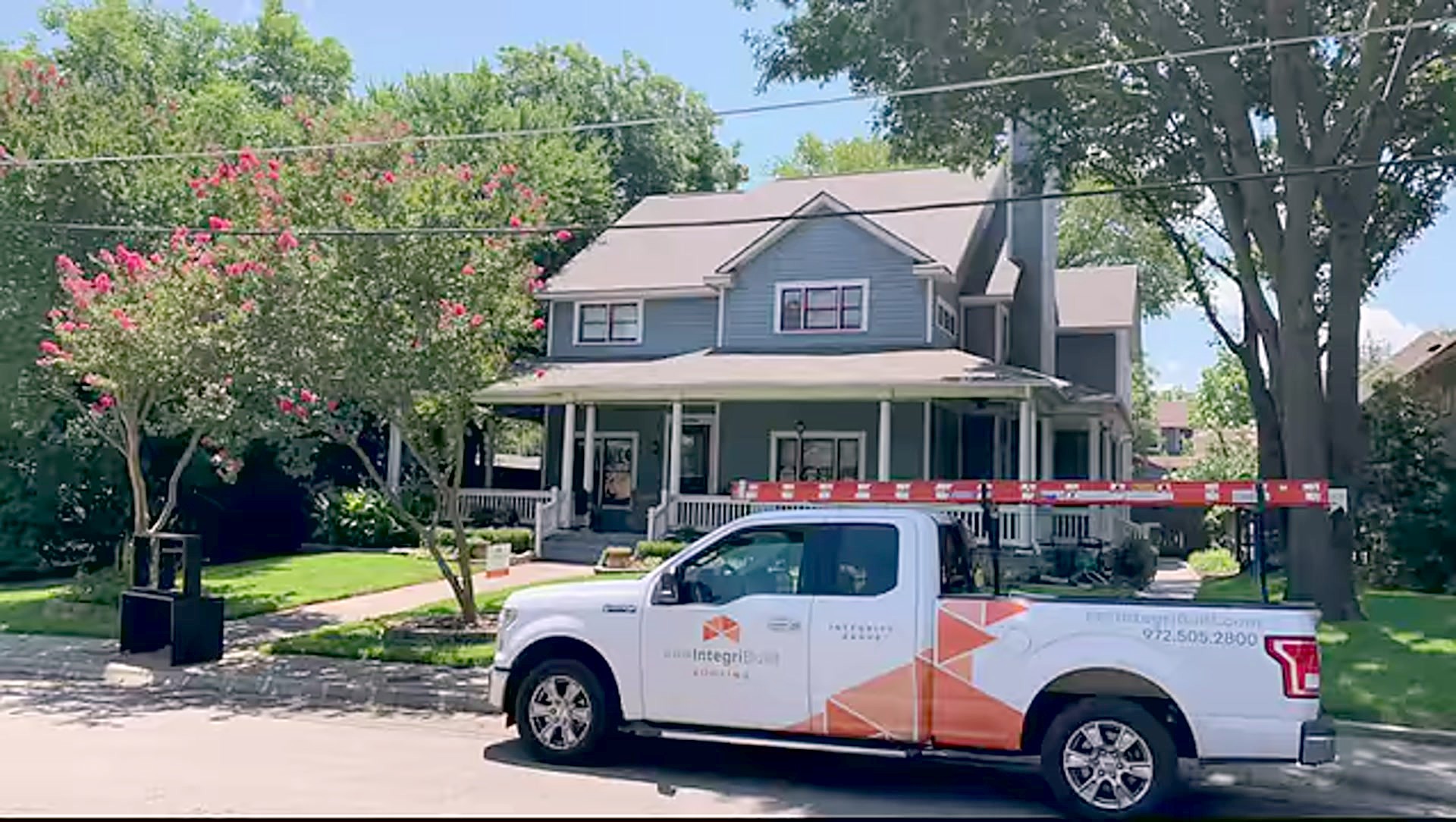 An IntegriBuilt truck on the street outside a home in North Texas