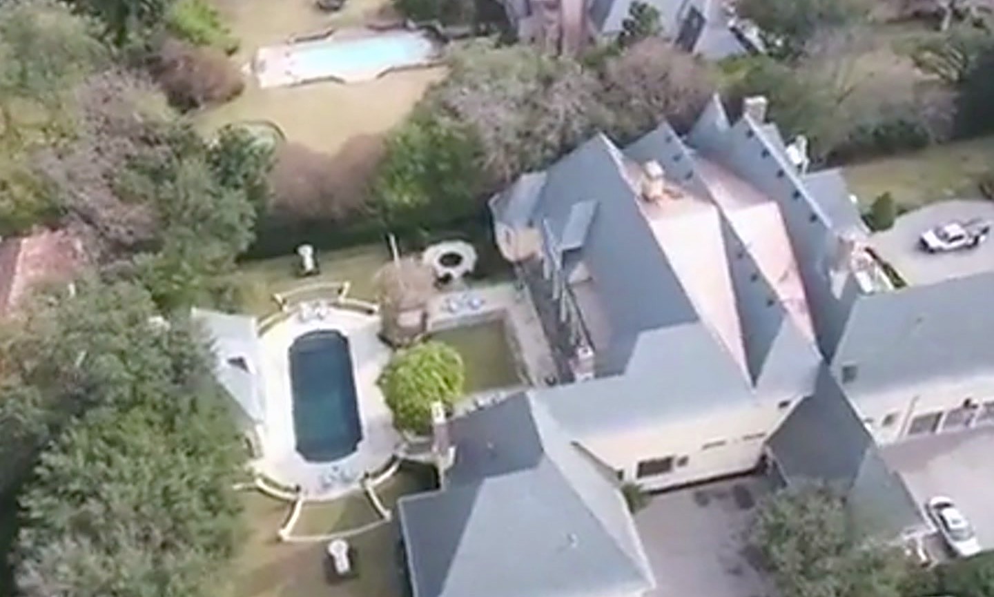 A large estate roof and its outbuildings photographed from the air