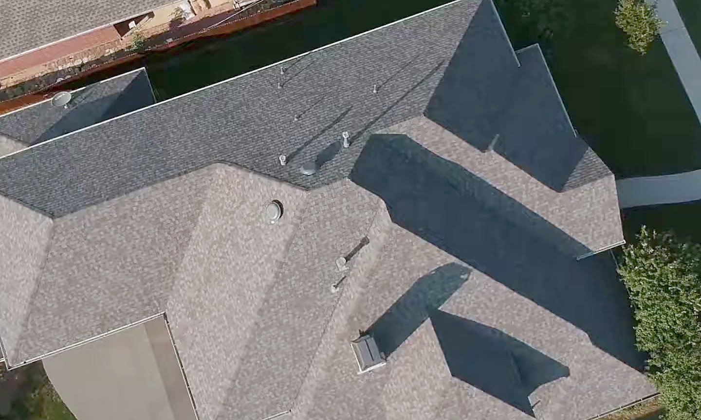 A newly shingled roof with the hips and valleys clean and cut in